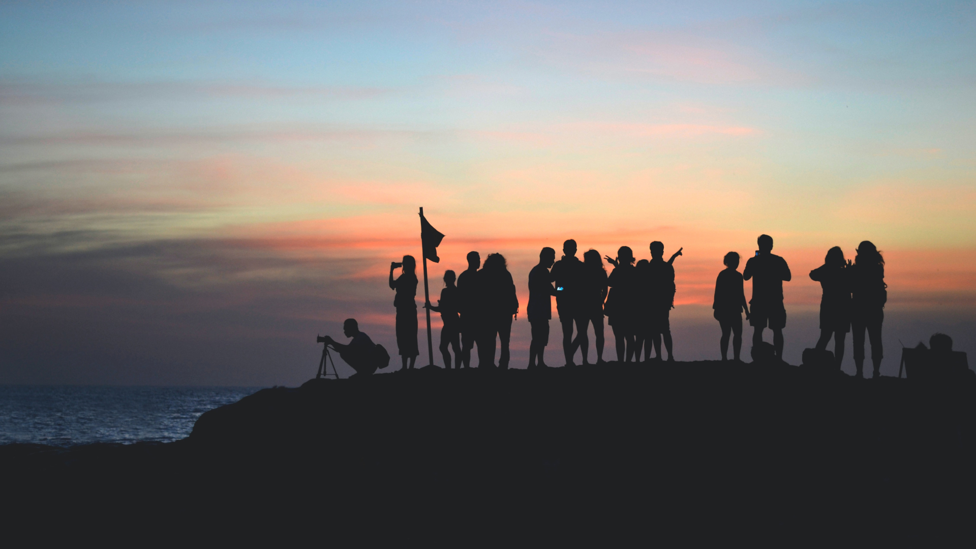 Silhouette of a group of photographers during sunset.